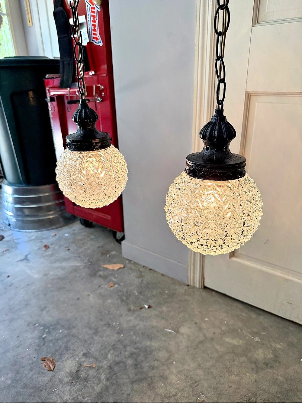 Amazing pair of vintage MCM black pineapple-textured glass pendant lights